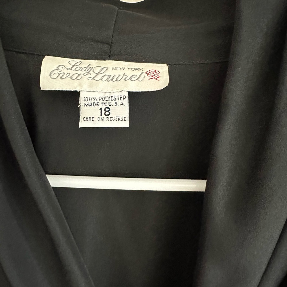 It’s very nice black polyester light blazer type shirt